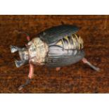 A Vintage Lehmann Tin Plate Wind-up Scurrying Beetle with flapping wings; it's back marked Pat. U.S.