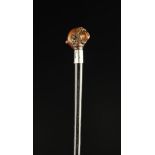 An Edwardian Novelty Walking Stick with an articulated boxwood handle carved in the form of a