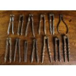 A Group of Thirteen Old Nut Crackers, mainly steel.