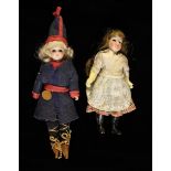 Two Small Bisque headed Costume Dolls with glass inset eyes, mohair wings and composite limbs,