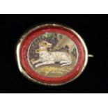 A Small & Fine 19th Century Gold Mounted Micro Mosaic Brooch depicting a dog reclining in landscape,