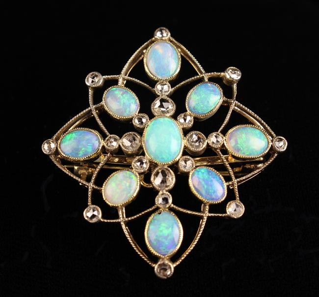 An Attractive Edwardian Opal and Diamond Pendant, with detachable brooch fitting.