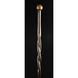A Fine Lignum Vitae Walking Cane with a pommel handle and twisted twin-bine section to the tapering