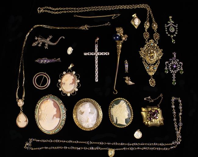 A Collection of Decorative Costume Jewellery: A Victorian gilt metal locket brooch set with five