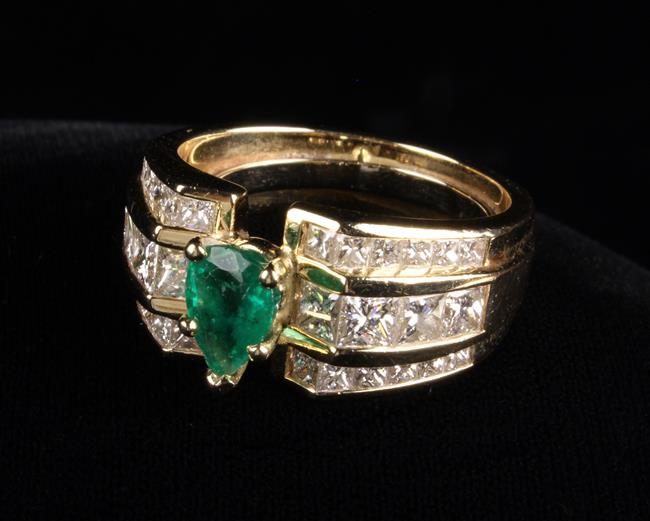 An Imposing and Beautiful Emerald and Diamond Yellow Gold Ring.