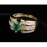 An Imposing and Beautiful Emerald and Diamond Yellow Gold Ring.