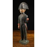 A 19th Century Painted Wooden Folk Art Figure of a one-armed General wearing a bicorn hat,