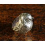 A Small Edwardian Silver Pincushion in the form of a chick hatching from a shell,