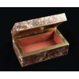 A Small Porphyry Box of rectangular form with hinged lid and gilt metal mounts, 1½" (4 cm) high,