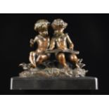 A 19th Century Bronze Figure Group of two putti sat on a leafy base;