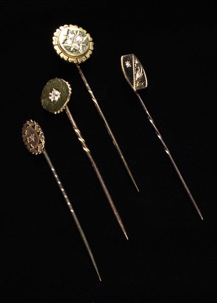 A Collection of Four Gold and Diamond Stickpins.