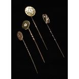 A Collection of Four Gold and Diamond Stickpins.