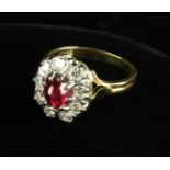 An Impressive Cabochon Ruby and Diamond Ring, the approx 1ct ruby with a very good natural colour.