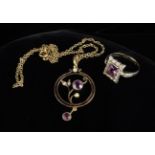 A Pretty 9ct Gold Pendant set with two amethysts and seed pearls, on a gold coloured necklace,