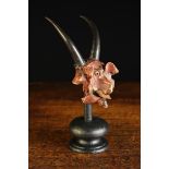 An Unusual Curio: A Painted Model Head of 'Old Nick' made from a Mutton Vertebrae with an