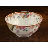 A Pretty Late 18th Century Bowl with fluted sides and serpentine rim decorated with sprays of pink