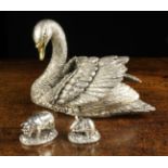 Three Modern Silver Clad Ornaments: A model of a swan with finely detailed plumage and a gilded