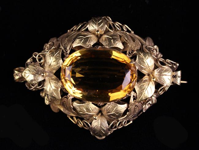 A Pretty Victorian Citrine and Yellow Gold Brooch. The large central citrine stone, approx. 21 x 14.