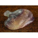 A Coloured Quartz Paperweight, possibly Fluorite carved in the form of a lizard on rock,