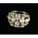 A Beautiful Art Deco Diamond and Pearl Ring. The principal cushion cut diamonds, approx.