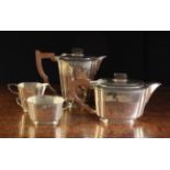 A Silver Tea Set by Henry Clifford Davis, hallmarked Birmingham 1961, comprising of a teapot,