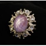 A Rare and Unusual Vintage Lilac Star Sapphire, Diamond and Moonstone ring. The large, approx.