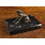 A Small 18th Century Bronze Whippet sat on a rectangular slate base.