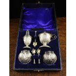 A Silver Plated Cruet Set comprising of a pair of salts modelled as scallop shells on ball feet