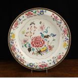 A Large 18th Century Famille Rose Dish decorated with flowers, fruit and foliage,