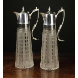 A Pair of Hand Engraved Glass Claret Jugs with decorative silver plated handles,