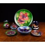 A Group of 20th Century Moorcroft: A 1983 limited edition plate decorated with hibiscus on a green