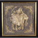 An Indian Stumpwork Panel depicting a figure riding an elephant stitched in metallic threads with