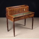 A 19th Century Mahogany Veneered Writing Table inlaid with stringing.