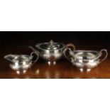 A Heavy Edwardian Three Part Silver Tea Service by Edward Barnard & Sons Ltd with assay marks for