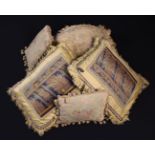 Five Tapestry Covered Cushions: A pair with fragment panels of 17th century border tapestry edged