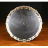 A Silver Salver with beaded serpentine edge and an engraved initial to the centre,