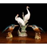 Three Ceramic Bird Ornaments: A Lladro group of two herons stood amongst bull-rushes with a flower