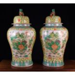 A Pair of Large Chinese Floor-standing Temple Vases of rising baluster form with domed lids