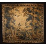 An 18th Century Verdure Tapestry depicting a bird in parkland flanked by leafy trees with faded