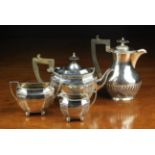 A Three Part Silver Teaset and a Hot-water Jug.