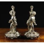 A Pair of Louis XVI Style Silver Metal Figural Ornaments, once converted to side lamps,