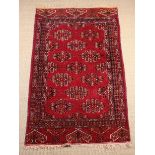 A Small Hand-tied Claret Ground Turkish Carpet Rug 64" x 37" (162 cm x 94 cm).