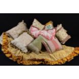 A Group of Nine Decorative Scatter Cushions, mainly in pastel hues, and a near round,