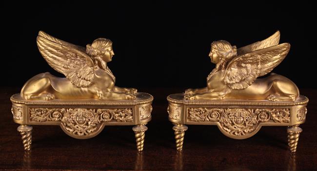 A Pair of French Empire Style Gilt Bronze Fire Dogs.