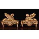 A Pair of French Empire Style Gilt Bronze Fire Dogs.