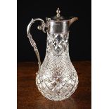 A Silver Mounted Cut Glass Claret Jug hallmarked London 1977 and stamped with maker's punch for