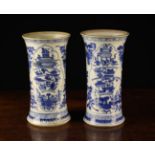 A Pair of Kangxi Blue & White Sleeve Vases (A/F) of flared cylindrical form, 8¾" (22 cm) in height.