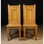 A Pair of Golden Oak Gothic Revival Side Chairs with arched tracery panel backs,