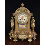 A Decorative 19th Century Mantel Clock with porcelain inset plaques and figural mounts.