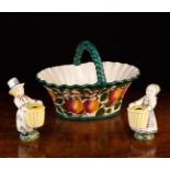 A Wemyss Basket (A/F) and a Pair of Norwegian Figural Match Holders modelled as a boy & girl